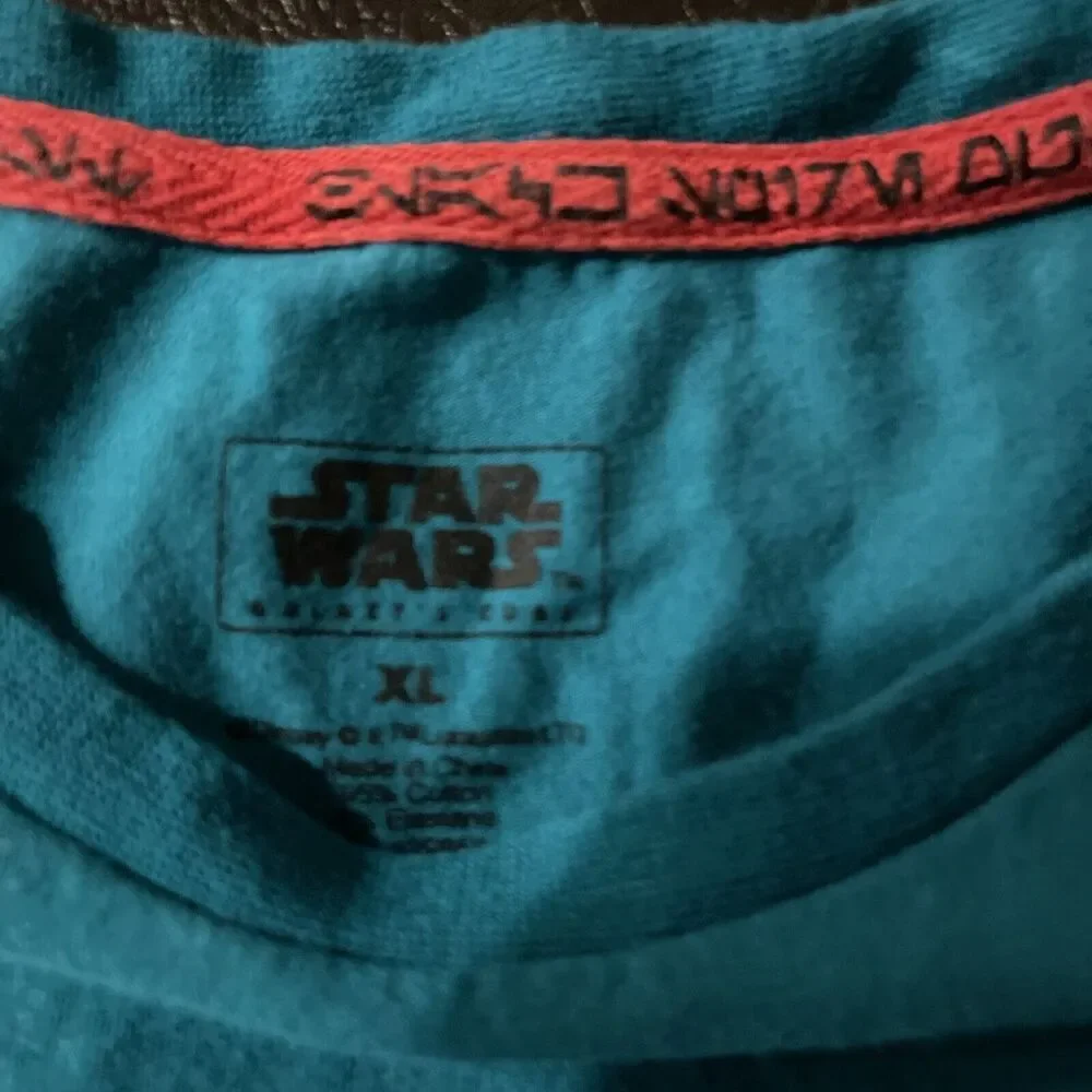 Star Wars Galaxy’s Edge kids Size extra large Turquoise Short Sleeve Shirt